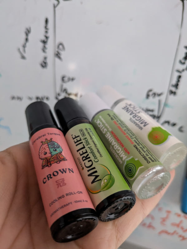 CROWN cooling migraine roller by Cerebral Torque next to Migrastil Migraine Stick, Migrastil with Magnesium, and MigreLief Comfort Stick